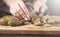 Cook cuts pickled cucumbers, knife in female hands, cooking process, beautiful little cucumbers, close-up, chef cuts cucumbers,