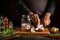 The cook cuts the raw fish into steaks and then cooks the herring in a jar. Working environment on the kitchen table with aromatic