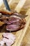 Cook cuts sliced meat picanha