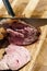 Cook cuts sliced meat picanha