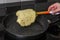 Cook fries pancakes in a pan on an induction cooker