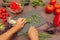 Cook hands chop fresh leek on rustic wooden table