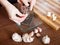 Cook hands grating garlic with grater