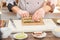 Cook hands making japanese sushi roll.