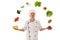 Cook juggling with fresh vegetables