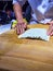 Cook making Turkish Gozleme, a traditional Anatolian stuffed fla