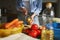 The cook peeling off potatoes with a peeler tool. Woman preparing vegetables for lunch in the home kitchen