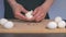 Cook is Peeling White Chicken Eggs