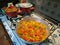 Cook peppers with onions, olives, parsley and carrots