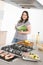 Cook - plus size woman grill fish in kitchen