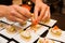 Cook prepared delicious gourmet canapÃ© starters on white plates