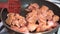 Cook prepares fried pieces of pork in a pan in the kitchen, close-up. Frying tasty meat.