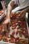 Cook preparing dried tomatoes