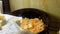 The cook puts butter cut into squares at the chashushuli. Chashushuli traditional Georgian food. Food prepared from beef