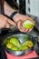 Cook`s hands clean the pear. Preparation of the pears to caramelize and cook chutney. Close up