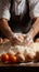 Cook\\\'s hands expertly incorporating an egg into a flour pile for cooking