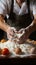 Cook\\\'s hands expertly incorporating an egg into a flour pile for cooking