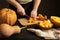 The cook slices the pumpkin for baking.