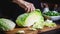 Cook slicing Chinese Cabbage into slices