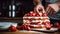 Cook slicing a Strawberry cake into slices