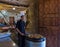 A cook stands near a large tray with a meat dish and waits for visitors in a roadside restaurant near the city of Wadi Musa in Jor