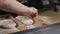Cook to form raw dough on parchment paper for further bread preparation.