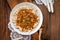 Cooked barley porridge and stew of pork.