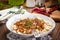 Cooked barley porridge and stew of pork.