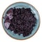 Cooked black rice on blue plate