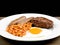 Cooked Breakfast or Meal of Fried Egg Sausages Baked Beans and a