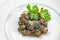 Cooked Burgundy snails in white plate