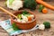 Cooked cauliflower and broccoli in clay bowl