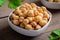 Cooked chick peas in white bowl