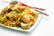 Cooked chicken breast pieces with savory garlic and ginger soy sauce and  noodles, black fungus mushrooms, savoy cabbage, and