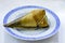 Cooked Chinese zongzi placed on white plate