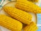 Cooked corn, a plate autumn healthy fresh natural agriculture ingredient food appetizer on a blue wooden background,