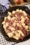 Cooked corned beef hash in a cast iron pan