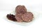 Cooked cotechino salame with beans served on a plate