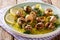 Cooked French snails, escalgot with butter, herbs, lemon and gar