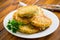 cooked fried potato cutlets with herbs