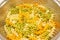 Cooked fusilli tricolore pasta in drain strainer close up