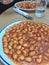 Cooked haricot bean with tomato sauce on table