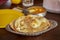 Cooked Indian style chapati in plate on table.