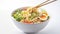 Cooked instant noodles sprinkled with spices, vegetables, herbs