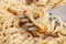 Cooked instant vermicelli in bowl and fork closeup