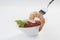 Cooked Jumbo shrimps with tomato salsa and mint with fork on white background