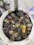 Cooked limpets or Lapas on a frying pan. Traditional Madeiran dish