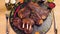 Cooked meat, appetizing ribs and medallions are served on a tray