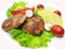 Cooked meat cutlets with vegetables