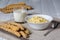 Cooked millet porridge, milk and millet stalks